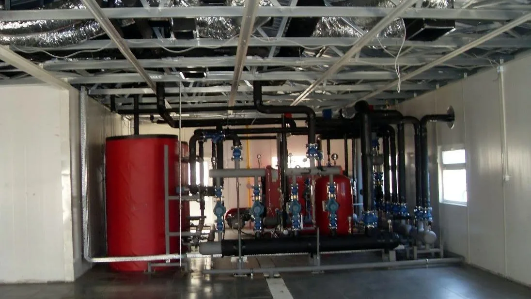Treatment plant room with pressure vessel and pumps