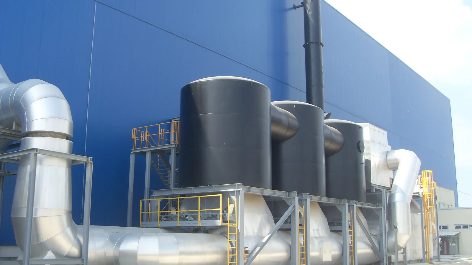Silos and ducting outside a production building